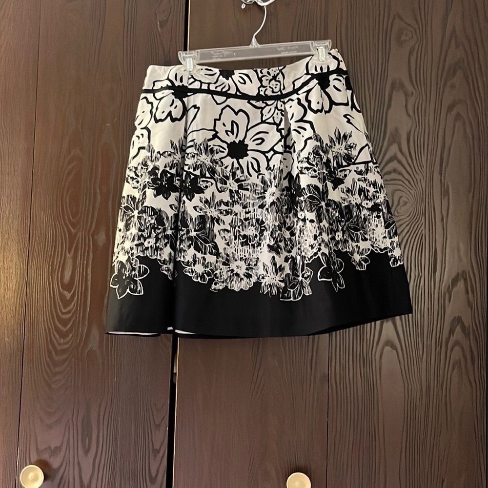 Sharagano ivory with black flowered skirt. Size 10